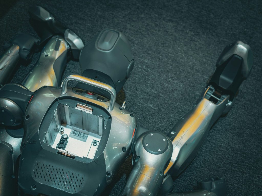 A robotic torso with exposed internal components and arms